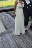 Such a cute spring/summer dress. I got it hemmed and was still able to keep a good amount on the bottom tier on. It held up perfectly all night. - Taliyah P.