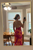 I really wanted to love this dress. It was absolutely stunning. The material and color was perfect for the upcoming summer wedding I am attending, and I loved open back. 

I sized down (normally a medium, ordered a small). The chest, waist, and hips fit very nicely. The material does not stretch.

My biggest concern was that the halter top was a bit tight on my neck because I'm so tall. I was planning to use tape to keep the  neck line closed and secure. 

The other issue was the thigh slit was fairly revealing especially when I hiked up the halter top to relieve the stress on my neck. A little more sexy than I was going for.

Very sad to send this gorgeous dress back. Would recommend to most folks but tall girlies beware! - Anna R.