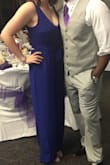 I wore this to a wedding and it was the perfect outfit for a night filled with dancing! It was a little bit long with 2" heels so I hemmed it a little bit before wearing. Other than that it fit my bust really nicely and I was able to tie the wrap to show off my waist. The material is very comfortable and the design makes it easy to get on and off. I will definitely wear this again. If you are my height and weight, but wear a smaller bra size, I suggest getting a Medium. I did a Large to match my bra size and it worked out great. Not to mention, I got a bunch of compliments on it! I definitely recommend this jumpsuit! - Meagan M.