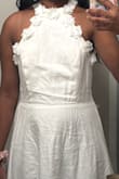 I love the mock neck and 3D flowers! They make the dress look classy and visually interesting. The rayon-linen blend is a very cooling material perfect for summer, but it's slightly see-through and HOLY WRINKLES. I'm glad I had a grad gown to wear over it because same-day high-heat ironing couldn't save this one; I'm more inclined to wear it to the beach than to another formal event.
I'm pear-shaped (XS bust, S waist, M hips), so I usually wear size S dresses with moderate success, but the top half of this dress was entirely too loose. The smocking only helps to stretch the material, not make it tight with elastic, so I recommend sizing down if you have a smaller chest. The middle portion and skirt are forgiving; even the waistband area was too roomy for me, and I have a curvier belly. I made it work with a strapless bra, safety pins, fashion tape, and prayers because there wasn't much time to wait for the dress in XS to arrive before my event. - Ria N.