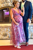 Loved the dress! It's super long (I'm 5'4) and it was dragging on the floor. For someone tall, it would fit perfect in length. I'm pregnant and ended up getting a XL due to the band under the bust being soooo tight. Had to get it tailored from the bust strap area and cut the length. I originally ordered a Large but then exchanged to XL. The customer service was amazing! They overnight shipped my XL without me having to pay a fee or sending the L back. I just had to make sure to return the L or XL within 10 days from receiving the XL. I would reorder from this site! - Mavely A.