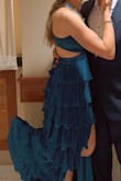 This dress is absolutely stunning! The pleats and material are so elegant, and the open back is not only beautiful but also super practical; you can adjust it to fit just right. It felt a little big at first, but the tie-back made it easy to get the perfect fit. The built-in slip made it super comfortable and easy to move in all night. I got nonstop compliments and felt amazing wearing it! - Kyley L.