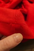 I really love the style of this dress and the color too; and that's saying a lot because I don't normally wear/feel confident in red. 

However, after just trying it on, when I went to unbutton the top button, I couldn't get it undone. It's because the material had already spliced around the button hole due to be sewn extremely poorly with no buttonhole stitching to reinforce the edges.
There were lose threads everywhere, and on the left arm, the lining was sewn approximately ¼" outside the bodice.

When I found Lulu's about 6 years ago, I was so excited that they offered unique,  stylish clothes, in a variety of sizes, at what I felt was a reasonable price. However, that is not the case anymore. The prices have gone up, and the quality has decreased substantially, as evidenced by issues such as this in my last several purchases from them.

At this point, I consider them to be a fast fashion company in terms of the quality, but certainly not the price point. I will not be patronizing them anymore. - Katey C.