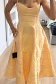 I typically never buy yellow, but this dress looked adorable, so I took a chance. It fits really well, but a little tight for me on top because C cup. Otherwise loved it and got a lot of comments on the dress at the wedding. - Chasity L.