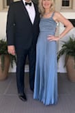 I was searching for a Mother-of-the-Groom dress. Loved this slate blue dress the first time I saw it!  I am usually a size S, so I ordered the dress in a S late summer of 2024 for June 2025 wedding.  Then proceeded to spend way too much time, looking at other dresses, just incase this was not The One!!   Dress was always snug when zipped.   Took to have altered in April 2025.  When picked up, the dress now easily zipped, but did not look good!  When the dress was made slightly bigger, they flattened the pleats below the bodice, on each side of the front.  Right away, I checked to see if M was available, not in stock until after the wedding.  Checked a week later and there were 3 mediums in stock.   Ordered and had shipped express.   Had the straps altered, dress shortened and removed the bow.  LOVED the dress and the way it flowed.  Received so many compliments!  Happy Endings are The Best!!! Photo on left is the true color. - Nancy B.