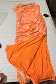 This dress is not pastel, or even light orange/coral. It's FLUORESCENT orange. Definitely not the vibe I'm going for. - Sonja L.
