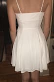 I plan on wearing this dress to my graduation, and it couldn't be cuter!! It has a wonderful fit at the top and is beautifully loose and flowy below the waist. The button up style and extra fabric on the top give it a unique touch to an otherwise simple style. Love it and will wear it lots!!! - Lara N.