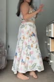 I saw a friend of my sister wearing this set and immediately fell in love- it's so difficult to find a skirt and crop set that looks good and fits a short frame and short torso, especially when you're busty. The quality of this set is beautiful, with thick fabric and gorgeous embellishments. Both the top and skirt have zippers and fit snug but not too tight. For me, the skirt hit at my ankles, which was fine! I would definitely recommend this set to anyone- it looks great on every body type and will last! - Adrienne W.