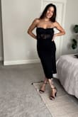 Needed a Medium to provide breast coverage, and the bodice uses plastic boning. It doesn't lie flat to the skin but bows outward. It costs more than the dress just to have it altered, very beautiful. Very cute dress overall. - Maxene H.