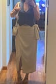 What a great top! Fits true to size, the detailing on the back is so cute! Check the photos - Camille S.