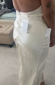 This is a beautiful ivory dress!! I looooved the fit- the cut is very flattering to an hourglass figure. The quality is great, nice thick fabric with lining, so no see-through issues! My only problem is that the zipper would not sit flat even when I tried pulling it down. If it wasn't for the zipper problem, this probably would've been my engagement party dress!! See pics about the zipper. Maybe I just got a faulty one - Karla T.