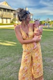 I'm obsessed with this jumpsuit! I've already worn it twice! It was perfect for a beach vacation and my girl's first birthday party! - Kristyn L.