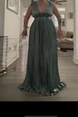 Once I figured out to adjust the back, the dress fit well if not a tad small on the breast! The color was way better in person than in the picture. The length is perfect for my height and I'm excited to wear it for the wedding! - Katie G.