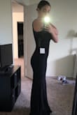 I was very skeptical about this dress after reading the (somewhat) mixed reviews. I've always been in between sizes (small and medium) so I never know what size to order. But, I ordered this dress on a whim because it was only sale for $25! I'm so glad I went with the small, it fits perfectly. There's not much length so for us taller girls, expect to wear a shorter heel. I'm pretty hippy & have a larger chest but the fabric is pretty flexible. - Ali P.