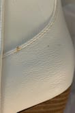 Chuck of the leather missing, and appears to have peanut butter smeared and stains on it - Abby G.