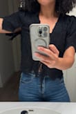I was so excited about this top! It's cute in and I love how feminine the material is. I took the tags off, wore it for the first time, and the left sleeve ripped as I lifted my arm up. The right arm is still intact after the exact same movement. The top didn't fit snug when trying it on, which is why I kept it. I'm really bummed about this, given the price point. - Cierra C.