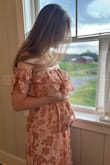I got this dress for my brother's summer wedding. A small fits perfectly with my little baby bump. The dress was very comfortable and flattering. It has a gold shine to it that I didn't notice in the picture. It's beautiful and comfortable! - Liz D.