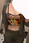 This top is super cute. I found the quality to be as expected. It's not amazing, but for the price, it's really not bad. The flowers are a bit scratchy on my arms/armpit, the photos I'm wearing a sweatshirt to help with the scratchiness, but after a few drinks, I wasn't bothered. It also gave me a teeny tiny muffin top, but it really isn't that noticeable. Finally, the straps were slightly bothersome, but they are also removable. - Rhi P.