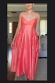 I wanted this dress to work so badly because my pear shape (tiny breasts, slim shoulders, and two sizes larger in the hips) works well in a-line skirts, and with the gathered side hip, it was a style I was hoping to try. Out of the bag, it's pretty obviously poorly sewn. Uneven hemline, tiny threads poking out, and slight fray on the straps. The fabric-although very pretty, was not high quality or accurate to the coral color I was expecting. But the lining of the dress does help it feel comfortable. After ironing on the synthetic setting, the dress started to come together. I still need to add a lifting sticky bra for my chest to sit right. And you really have to pull the back strings to lift the dress up. But overall, it's a pretty style and I think it can work. - Abigail K.