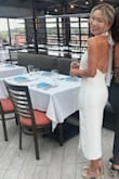 This was my first ever lulus purchase and wow was it a good one! I bought this for an engagement party in Rhode Island and got SO many compliments on it. The bow and low back are so dramatic and sexy without being over the top. The length was really nice (though I would caution taller girlies as I am 5'3 and thought the slit sat just right) and the fabric was fairly stretchy so I didn't have to worry about being uncomfortable throughout the day. I saw some other reviewers complaining about it being see through -- I didn't experience this, though I did wear nude shapewear and pasties. I wore out out after the party to a few more bars and it was super comfy/easy to dance in. Got it on sale but would not hesitate for a moment to purchase it again full price. 10/10 for any bridal type event! - Samantha P.