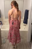 This isn't a style I usually wear, but it looks great!! The back ties take a little bit of playing with to make the front look good. Have someone help you pull the strings where they need to be, and it'll fit great! - Katie P.