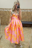 This dress was so beautiful; it was perfect for the wedding I wore it to! It was pretty tight as the material does not have any stretch at all. - Gabrielle K.