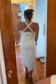 I forgot the straps were supposed to cross in the front, but in the back also works! Ignore my shoes, but this is in the running for my rehearsal dinner dress. Material is decently thick (I'm wearing shapeware). I'm curious to try to cross in he front how it's supposed to be lol - Isabella W.
