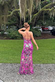 I absolutely love this dress! The colors are so vibrant and sparkly! It does run really long, though, so if you're on the shorter side, you'll probably need to get it hemmed. I'm 5'5 and with my tallest heels, I still needed alterations for the length. Since I wore this to a summer wedding in the south, I also had the material underneath shortened to my knee so there would be more of a breeze coming through the sequin material overlay! - Danielle D.