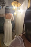 It is a cute dress. A little stretchy but not too much. Color is a truly white color. - Adriana L.