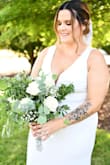 Had to get the length altered and got buttons to tie up the train for the reception, but loved it! So comfy too. - Emily K.