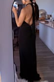TLDR: Cheap-ish material (sits oddly on the body), sizing is tough, LOVE the back though. Ordered in a size XS originally and it was too snug around the hips. Returned for a size up and the S was too big around the bust. The material itself felt a bit cheap. The way it wrinkles and hugs the body when you sit is not so flattering. Ordered for a black tie wedding and returned both sizes. - Angela L.