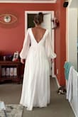Sat here all over the internet looking for the perfect wedding dress. Wanted something affordable, but good quality. I bought this dress, and the shipping was quick! It fits so wonderfully, and I'm in love with this dress. I got a Medium, but I'm a bit wide, so there are some restrictions for me in the ribs. - Monica G.