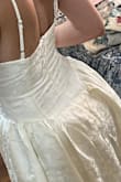 The dress arrived faster than expected. It's perfect, exactly like the picture! I bought it for a pre-wedding photoshoot, it fits the vibe I'm going for. I'm so pleased with this dress and I can't wait to wear it. 
Also, the sizing is perfect. I love the back so much. - Nardeen H.