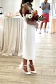 Looked and felt stunning at my bridal shower. Fit perfectly and was easy to accessorize with to fit my vision for the look. Paired it with unattached pearl sleeves and Steve Madden Valenteen heels to match the ribbon tie straps of the dress. Dress is 95% polyester with 100% polyester lining. Love that it's lined, but the polyester make-up held in ALL the heat at my Florida July bridal shower. - Kayla G.