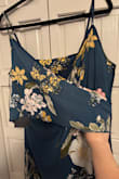 Love the dress color and fits fine, got an XL. Seems cheaply made for price? I would think similar things on Amazon would be around $30-$40.

A little long for my height, but fine. My least favorite thing is the bottom layer that covers one bust is like one short piece? Like the bottom wrap is like a small piece of fabric that moves around odd. Might use dress tape to hold in place. 

Probably would recommend for the price, but it works fine for my occasional, just feel like I paid way too much. - Jennifer S.