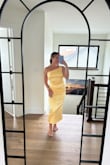 The dress is beautiful! It was a bit more golden yellow than the online image, but still a beautiful yellow. Highly recommend having someone to help tie the dress-it is hard to make work on your own! I got so many compliments on this look. - Hannah C.