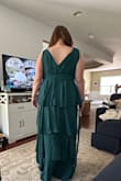 The dress is too long on me. It's a beautiful dress, but I'm going to keep looking on the site. I think I need to order the one that's right below the knee, still has the paper on the shoulders - Lindsey R.