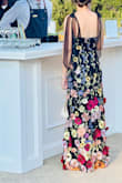 So cute, and I got several compliments! At 5'3", I wore it at floor length (wearing ~3.75" heels) for an outdoor black tie optional wedding. I'm impressed by the quality of the 3D flowers. They were thick enough to look well-made but not so thick they were too heavy to stand up on their own. Any wrinkles steamed out easily, and whatever wrinkles remained on the dress itself were obscured by the dark fabric. The long tulle straps are adorable and can be retied at whatever position and length you want.

Take a few moments before you wear it to trim all the extra threads from the embroidery, and be careful not to put too much weight on the dress while hanging. Even while using the hanging support straps, one of the tulle straps started to tear from the dress after only having hung up for a night. I reinforced it with some black embroidery thread and kept the same needle and thread with me at my event, just in case, but luckily didn't have any more incidents even after a full night of dancing. - Rebecca C.