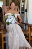 Eloped in Hawaii and this was an easy dress to travel with. No alterations needed- steamed it lightly prior to the ceremony. Very elegant for the price. The dress is substantial- 3 layers with beading on the top later- but was not too hot at our outdoor ceremony. The shoulders limit arm movement slightly but this is a beautiful off shoulder look. - Beth B.