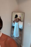 This dress is made amazingly, and it fits like a glove, but if you are flat chested like me, then the sides move due to extra fabric & will show your bra or chest. So I have to get fashion tape so the sides do not move & to pull to the side to get rid of the extra fabric in the chest area. I think for an xxs the chest area is way too big. Other than that, I love this dress. I'm 5'3", but I am wearing 3" heels - Ashlyn M.
