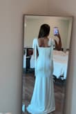The dress fits great! The "sleeves" are a little hard to tie if you are doing it alone, but other than that, I love this dress. I'm 5'3", but I'm wearing 3" heels. - Ashlyn M.