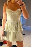 I had been eye balling this dress for months, just for it to be sold out for SO long! I finally received an email after a long awaited time that it was back in stock, so I ordered asap! I have all intentions of wearing it as my reception dress for my wedding! It fits perfectly and I absolutely love it! Only downside is that it is a little short, so I'll have to wear shorts under.  This dress really didn't fall short, though! - Jillian F.