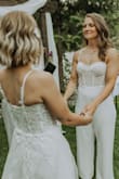 I waited for this jumpsuit to come back in stock for my wedding, and I was not disappointed! This jumpsuit fits me perfectly. I'm 5'4, 140lbs, muscular build (I think my mom hemmed the legs an inch or 2).  It's so comfortable, however still maintained a really classy look. The lace part did start fraying near the end of the night from moving around and dancing, however nothing that couldn't be tamed or flattened down. I'm so glad I was able to get this jumpsuit for my wedding, fit our vibe perfectly and I'm so happy. - Natasha S.