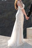 10 days before my elopement, I decided I hated my original dress & panicked ordered this, and I'm so glad I did! I didn't have any time to get it tailored, but the fit was perfect for me. Slightly long, definitely could've hemmed it, but it worked out! If you're on the fence, give this a try. The quality is amazing especially for the price. It looks so beautiful and the lace detailing is well done! - Taylor K.