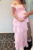 This dress is so cute! I wore it to my baby shower cause it matched the theme perfectly and it accentuated the bump perfectly! I got so many compliments on it. I ordered a small and a medium and ended up going with the small cause it fit better in the chest area, but I had lots of room for the bump! I'm 35 weeks pregnant. - Alivia C.