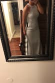 The dress was beautiful. It consists of stretchy material that just slides comfortable over your body. Very comfortable to move in. I loved it and would highly recommend it. Very satisfied. - Jennifer A.