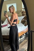 I didn't listen to the reviews, and I should have, but they never had XS in stock, so I was lucky to get a small. But I think the XS would be more flattering. 

I don't find this super flattering for my body type (kinda the same shape all the way down and tiny boobs), maybe if I were thinner, it would look better. Not sure. It's definitely comfortable. Hopefully, I can use it for vacations in the future, I just don't really love it. I wish it didn't have such a huge tie in the back because sitting is uncomfortable too with the big tie back. Maybe also if I wore heels with it, it could be more flattering. - Jamie W.