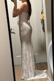 Dress is super pretty, the boning in the corset part of the dress was bent, so I'm hoping it will flatten while hanging. It could be SLIGHTLY tighter, but I think a size down would be too small. It's also very long, and I am 5'5. I am wearing really tall heels in the photo - Lexy E.