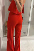 I love this jumpsuit! I wore the white one to my rehearsal dinner and loved it so much I ordered the red to wear to my brother's rehearsal dinner! Can't wait to wear it!! - Gretchen S.