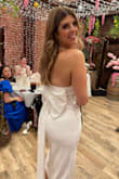 I wore the dress at my wedding shower. Great material, fit awesome. The overall look was so good! The bow in the back really set the dress off. - Katie H.